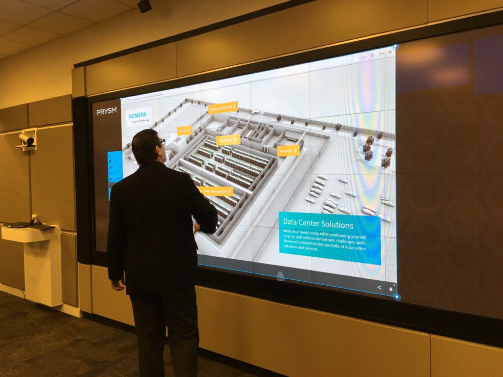 Interacting with the Siemens storytelling application on a large touch screen