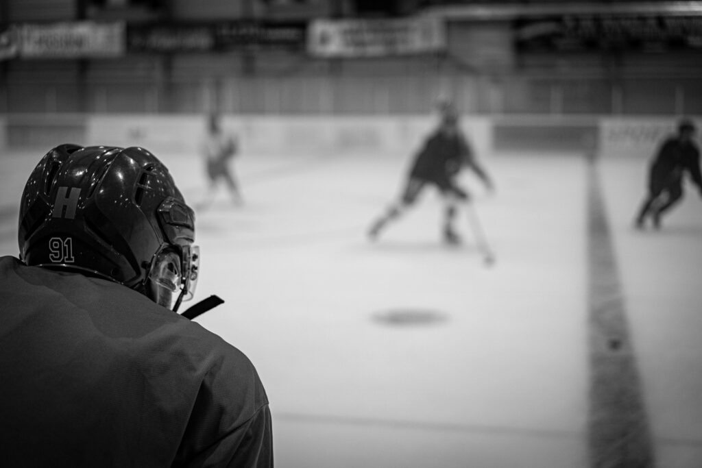 Goalie watching the puck in a hockey game.